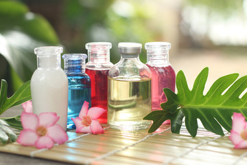 spa massage setting,  oil product  on wooden  nuture background