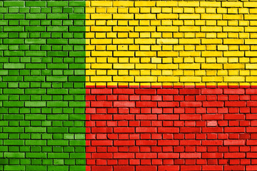 flag of Benin painted on brick wall