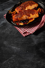 Baked salmon in pan with copy space