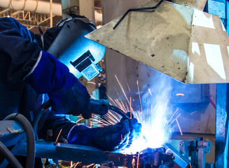 welding worker in the automotive part in Industrial
