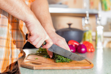 Man's hands cutting greenery