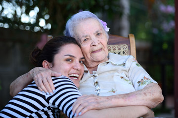 Grandma and grandaughter smiling