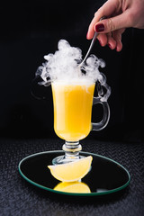 alcoholic cocktail with lemon and fume