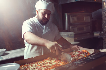 chef making pizza.