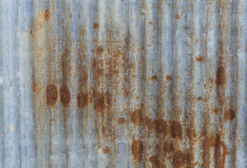 Brow rusty stain on blue metal wall background