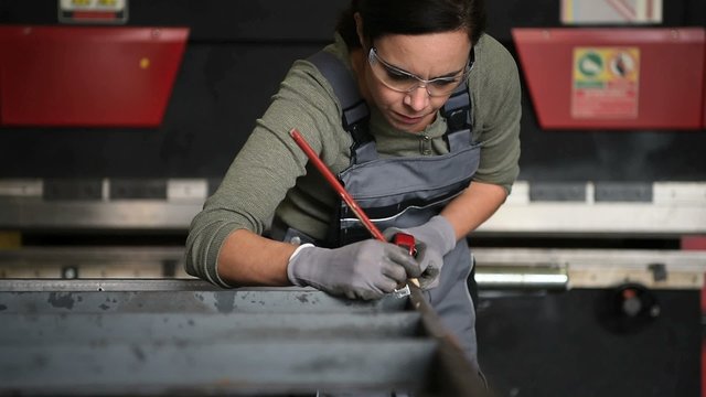 Metalworker woman in workshop