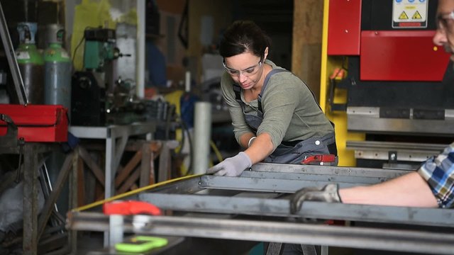 Metalworker woman in workshop