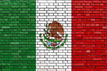 flag of Mexico painted on brick wall