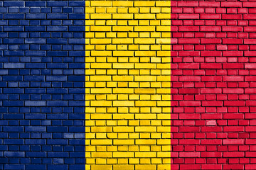 flag of Tchad painted on brick wall
