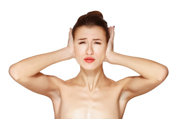 young lady closes her ears with hand