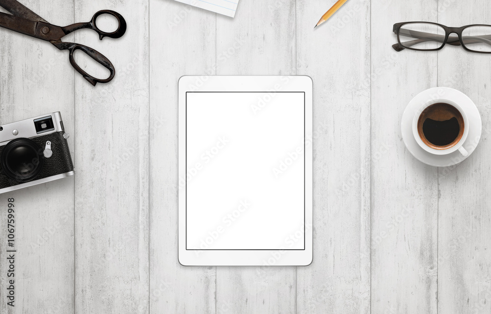 Poster tablet with isolated white screen for mockup. work desk with camera, glasses, coffee, notepad and pe