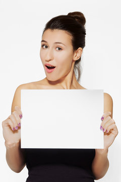 young lady holding blank sheet of paper
