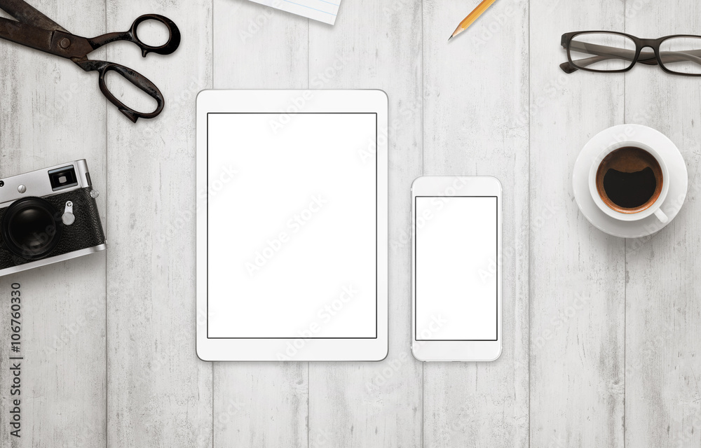 Poster tablet and smart phone with isolated white screen for mockup. work desk with camera, glasses, coffee