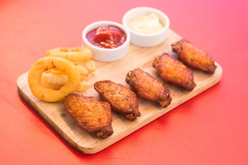 Close-up fried chicken wings with tomato sauce dip