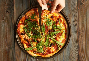 Home made pizza on wooden table