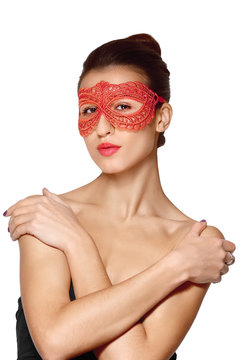 close portrait of sexy lady in red lace mask with rossed hands