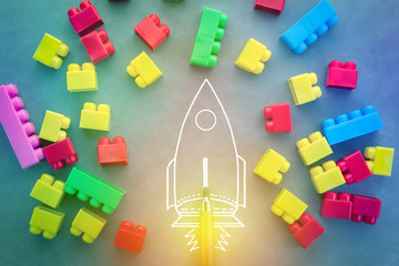 Flying rocket with colorful toy blocks