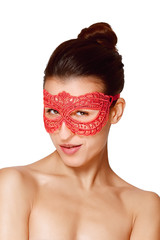 close portrait of sexy lady in red lace mask