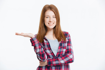 Smiling woman holding copyspace on the palm