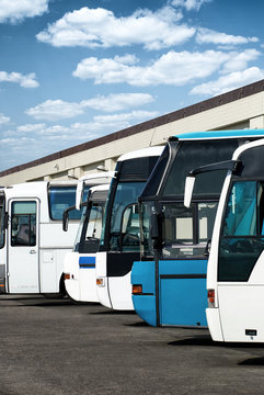 buses at the bus station with cloudy sky