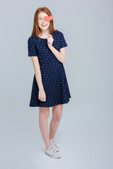 Smiling woman covering eye