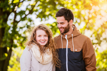 Couple in love  in autumn nature on a walk