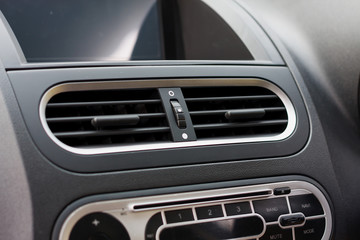 Fototapeta na wymiar Air conditioner in compact car