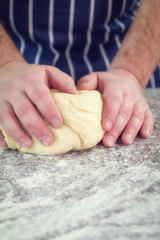 Baker kneading dough