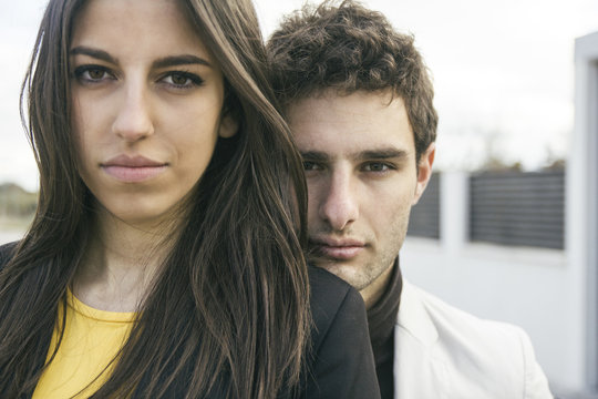 Portrait of serious young couple outdoors