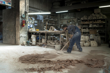 Germany, Munich, Art foundry worker in workshop