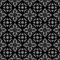 Fototapeta premium Elegant dark antique background image of round cross flower