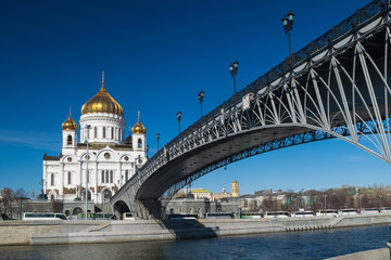 Obraz na płótnie Canvas View of the Patriarshy Bridge, Cathedral of Christ the Savior and tourist buses.