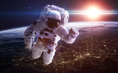 Astronaut in outer space. Spacewalk. Elements of this image furnished by NASA © Vadimsadovski