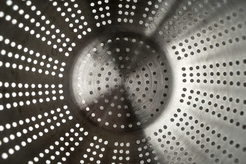 Metal colander background top view