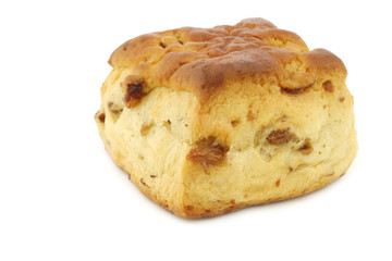 traditional english scone with raisins on a white background
