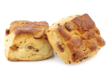 traditional english scones with raisins on a white background
