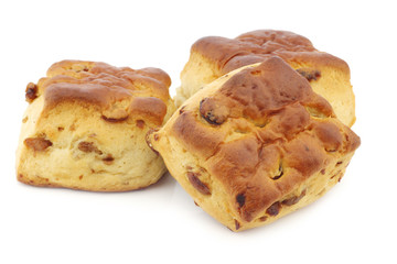traditional english scones with raisins on a white background
