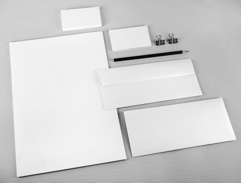 Photo of blank stationery set on gray background. Template for branding identity. Mock-up for ID. For design presentations and portfolios.