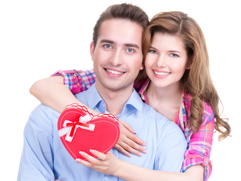 Happy young couple with a gift.