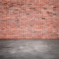Background with red brick wall and asphalt floor