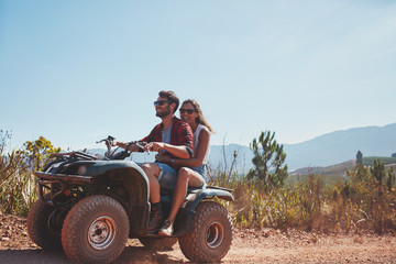 Couple riding on a quad bike © Jacob Lund