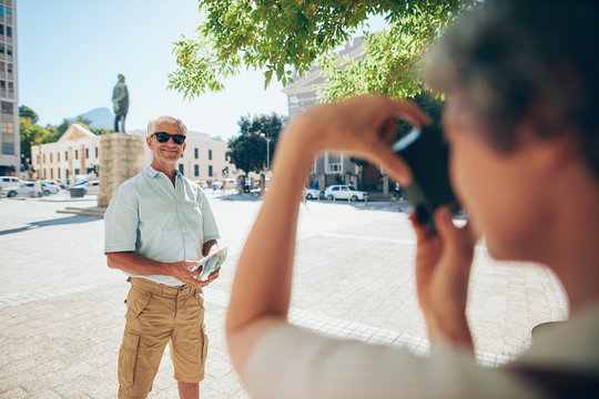 Senior tourist posing for photograph