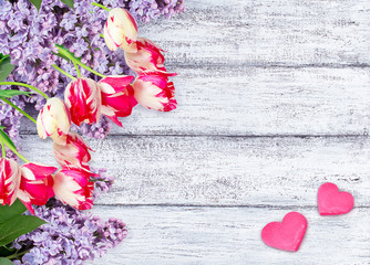 Lilac flowers with tulips with two hearts