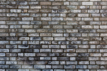 Fototapeta premium stary pęknięty ciemny mur z cegły tekstury