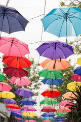 Fototapeta na wymiar colorful umbrella hanging on the rope