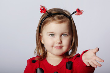 little funny girl in ladybug costume