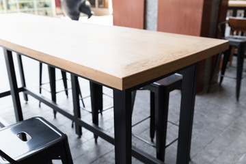 brown wooden table with stool