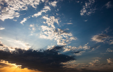Cloudscape with the sun rays radiating from behind the cloud