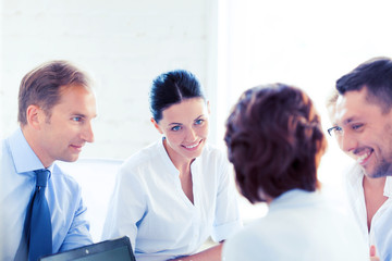 businesswoman with team on meeting in office