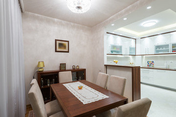 Pastel colored dining room with wooden table